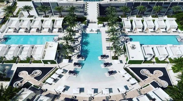 an aerial view of a house with a swimming pool