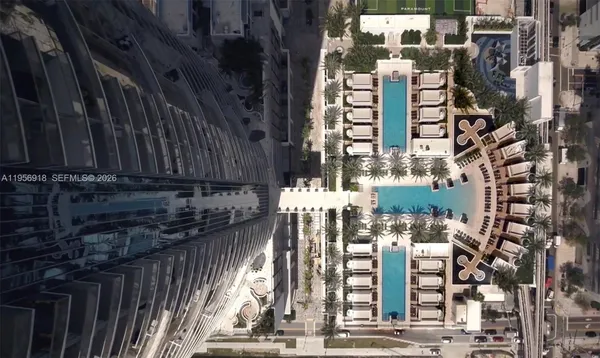 a table with chairs and a projector screen