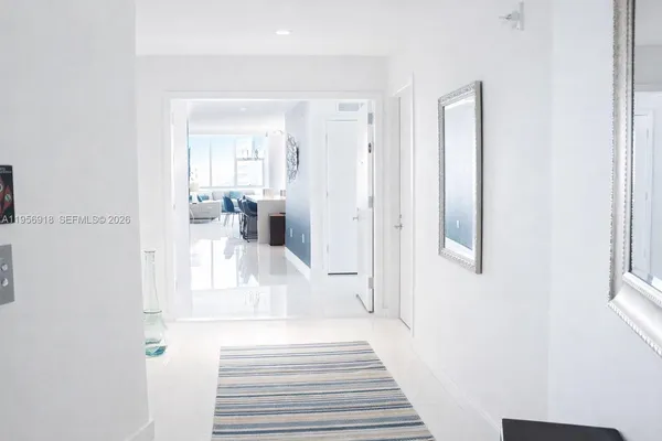 a view of a hallway with paintings on the wall