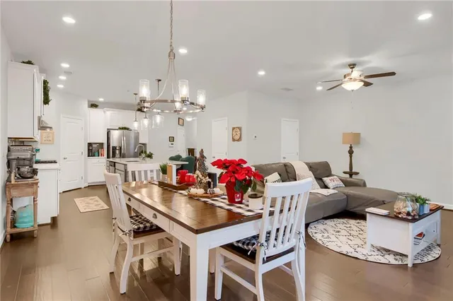 a view of a dining room with furniture and wooden floor