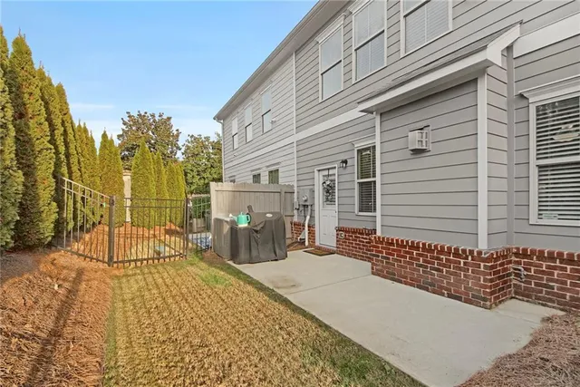 a view of a brick house with a outdoor space