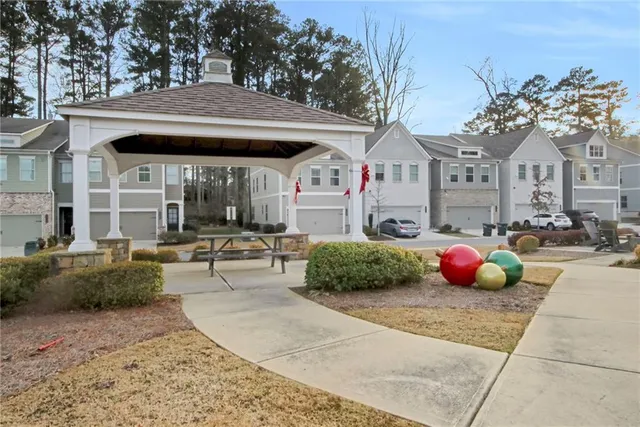 a view of a patio with a dining table and chairs