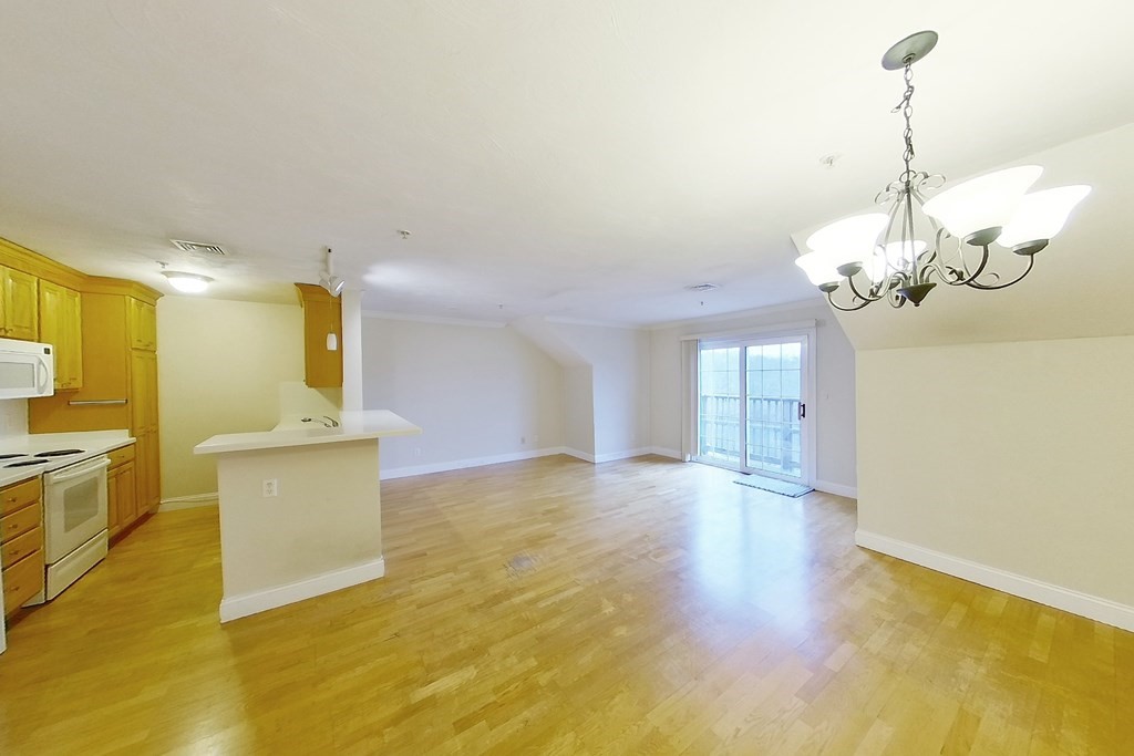 22 Forge Pond, Unit G Canton, MA 02021 - Photo 3 of 13 a view of a kitchen with a sink and dishwasher kitchen view
