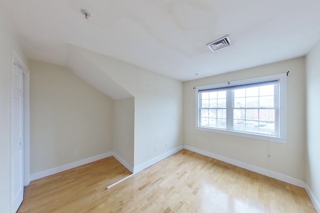 22 Forge Pond, Unit G Canton, MA 02021 - Photo 5 of 13 a view of empty room with wooden floor