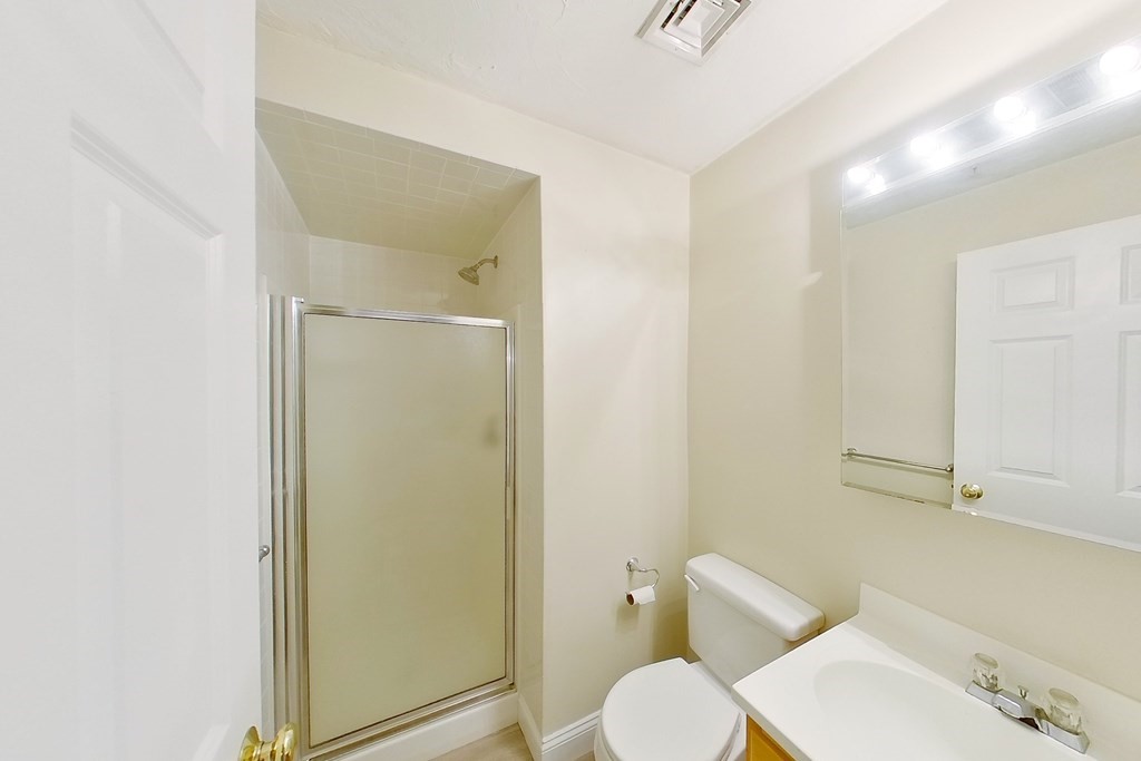 22 Forge Pond, Unit G Canton, MA 02021 - Photo 7 of 13 a bathroom with a toilet and a shower