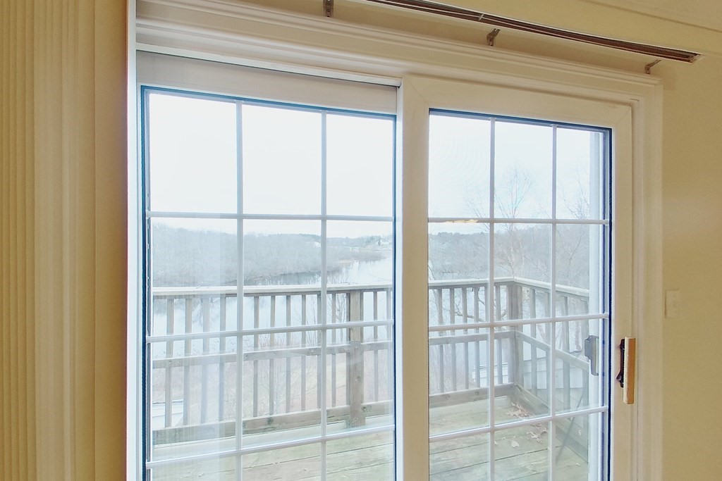 22 Forge Pond, Unit G Canton, MA 02021 - Photo 9 of 13 a view of a glass door and a window