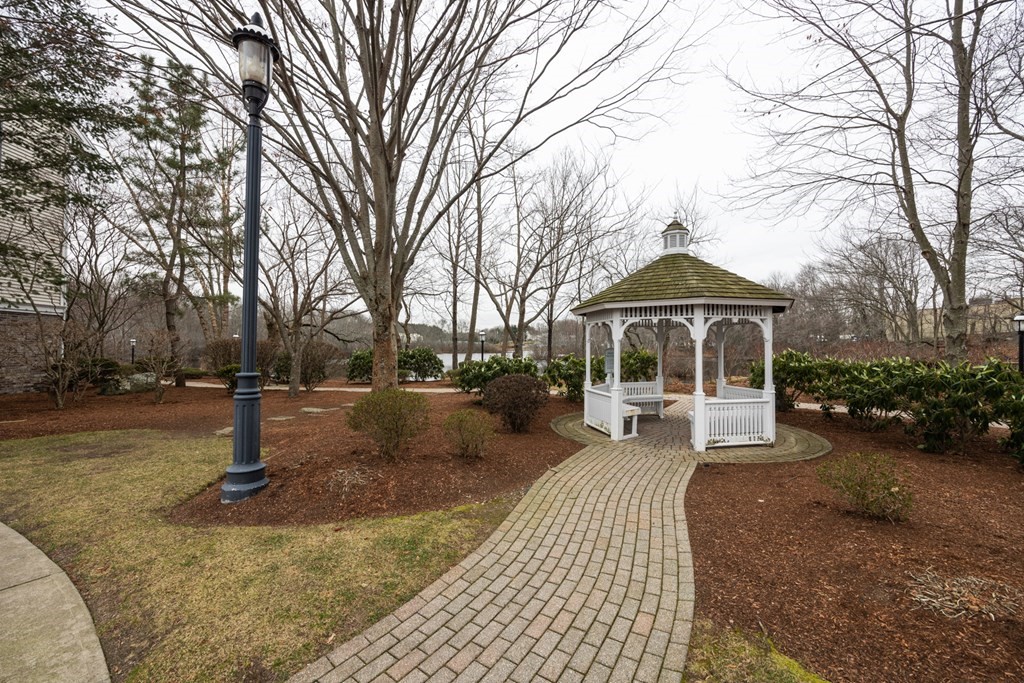 22 Forge Pond, Unit G Canton, MA 02021 - Photo 10 of 13 a front view of a house with a yard