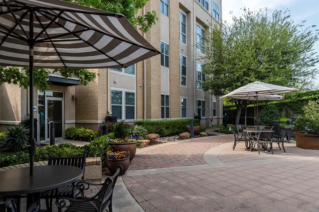 a patio with a patio table and chairs