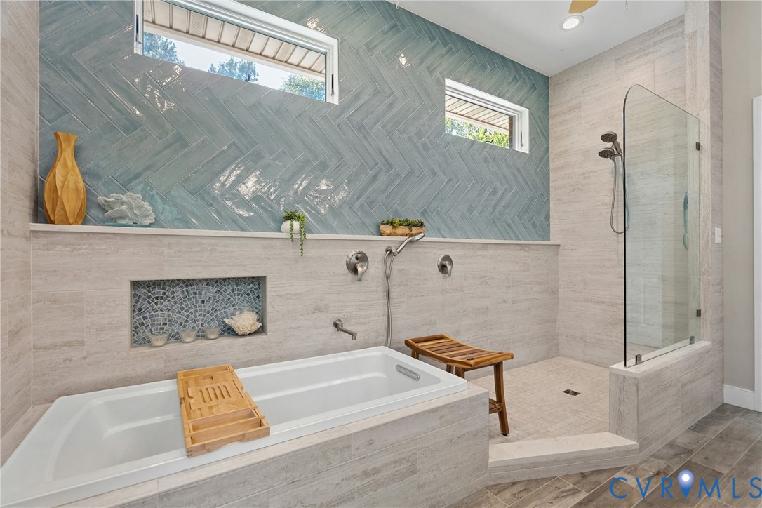 447 Tranquility Road Reedville, VA 22539 - Photo 20 of 82 Recessed bathtub with deck-mounted fixtures, walk-