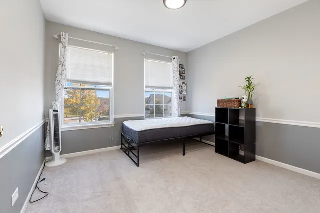 a room with a dresser and mirror