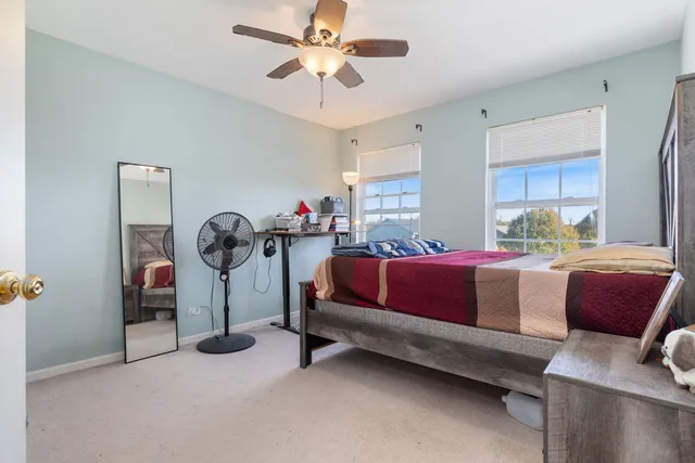 a bedroom with a bed and a cabinets