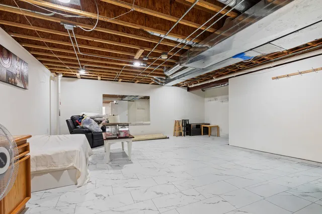 a view of a yard with furniture and tree