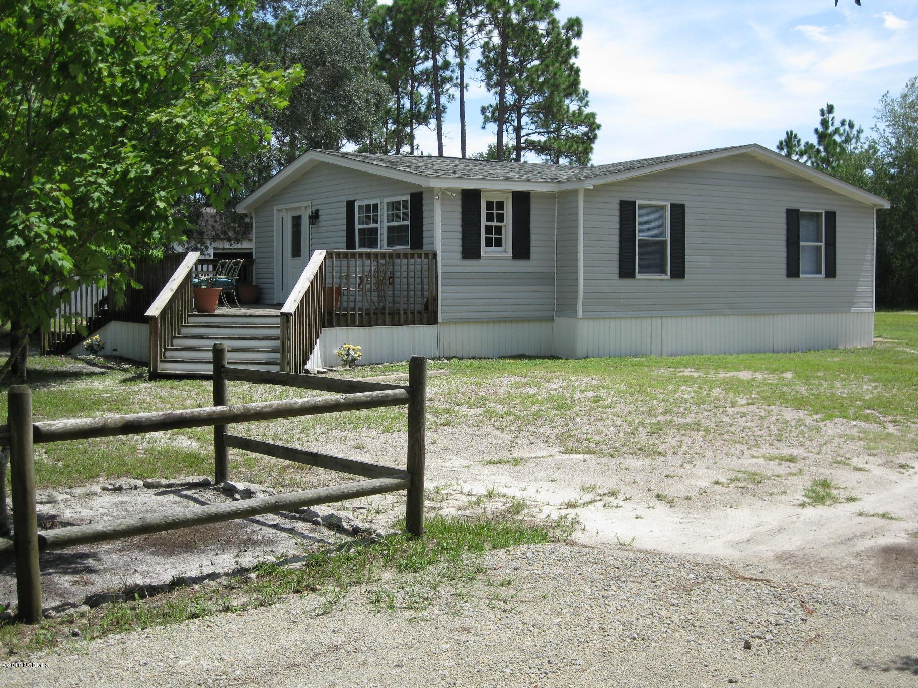 2621 Stone Chimney Road Southwest Supply, NC 28462 - Photo 2 of 20 Deck to front entrance
