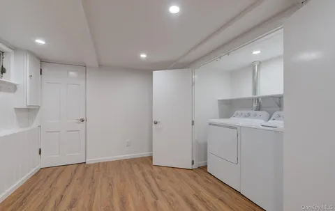 a view of bathroom with a sink mirror and shower