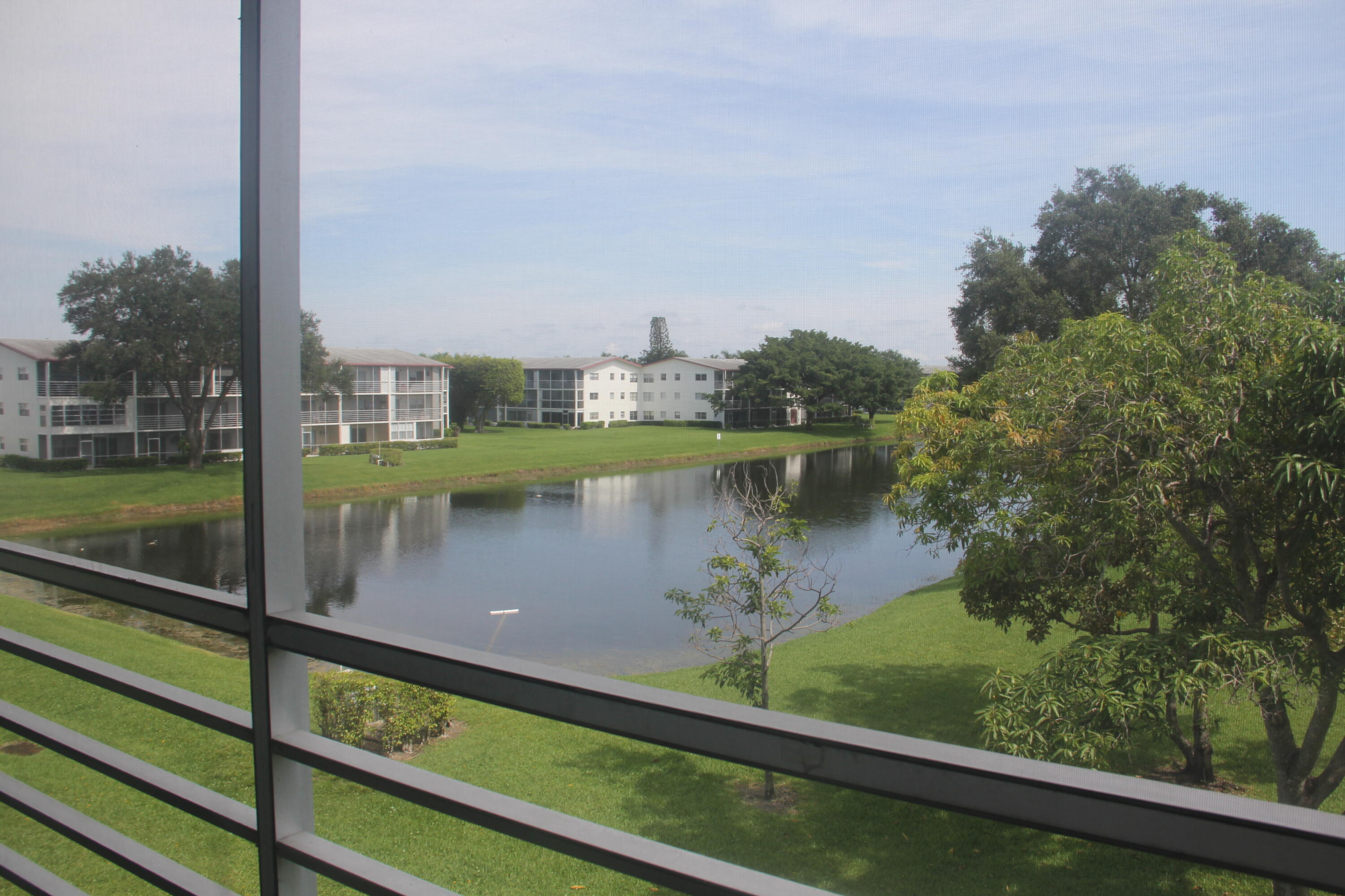 454 Fanshaw K Boca Raton, FL 33434 - Photo 11 of 30 Expansive Lake Views Screened Balcony