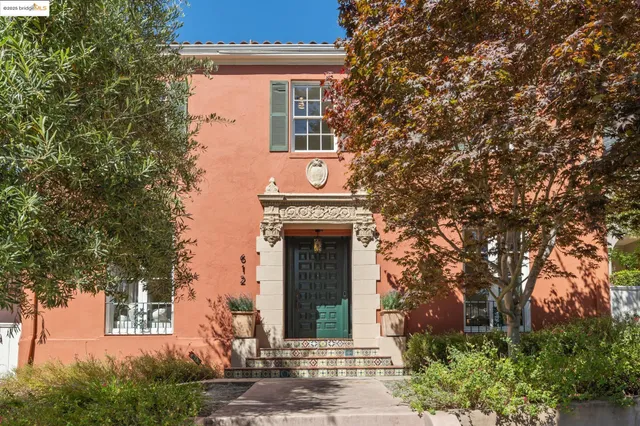 front view of a house with a tree