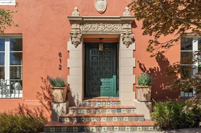 a front view of a building with a garden