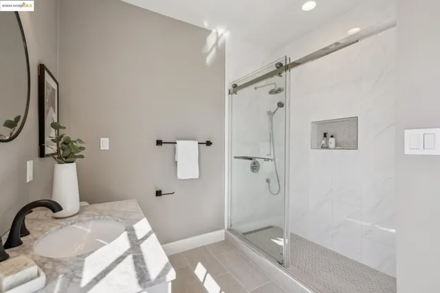 a spacious bedroom with two beds and a window