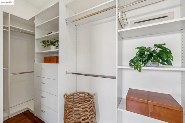 a bedroom with two beds and a window