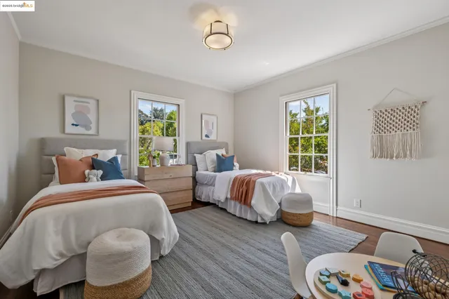 a dining room with furniture and a potted plant