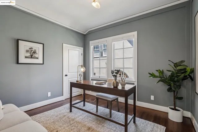 a bathroom with a tub a window and a shower