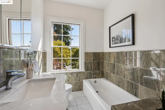 a living room with furniture and a kitchen