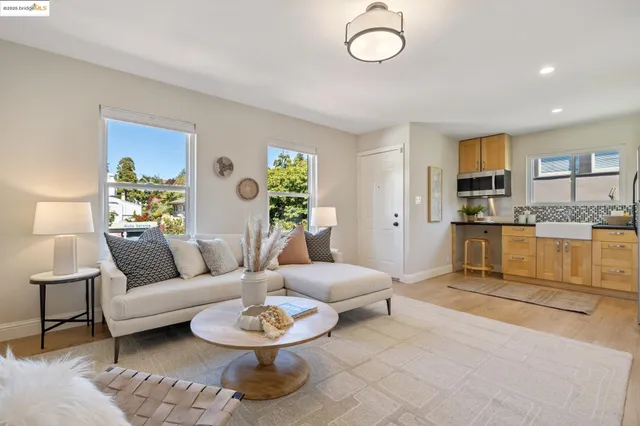 a kitchen with appliances a sink and cabinets