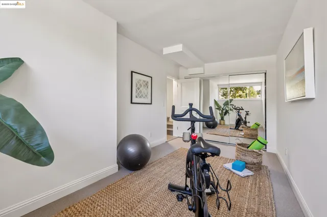 a balcony with wooden floor and outdoor seating