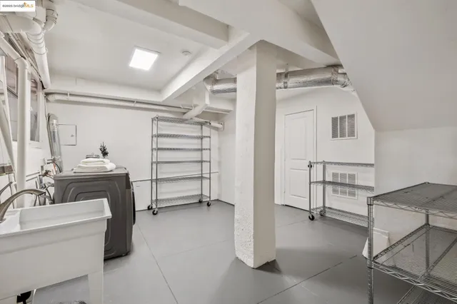 a view of a chairs and table in backyard of the house