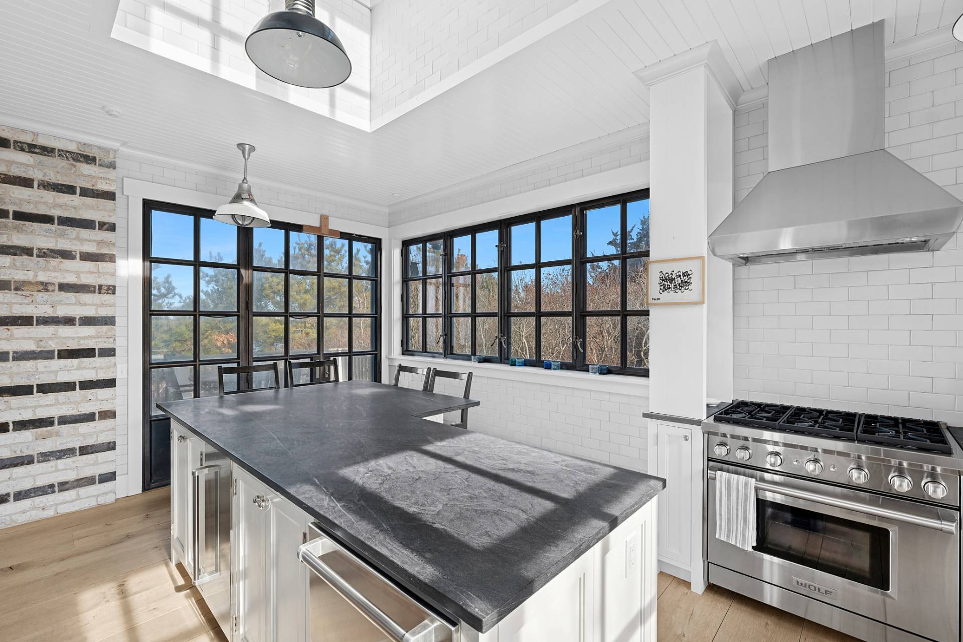 30 Private Road Amagansett, NY 11930 - Photo 11 of 26 a kitchen with stainless steel appliances granite countertop a stove and a sink