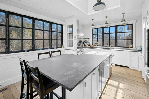 a view of a dining room with furniture and window