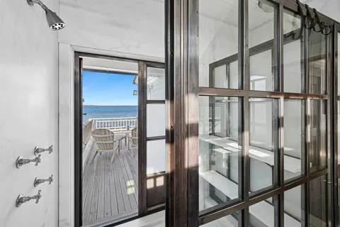 a view of staircase with railing and chandelier