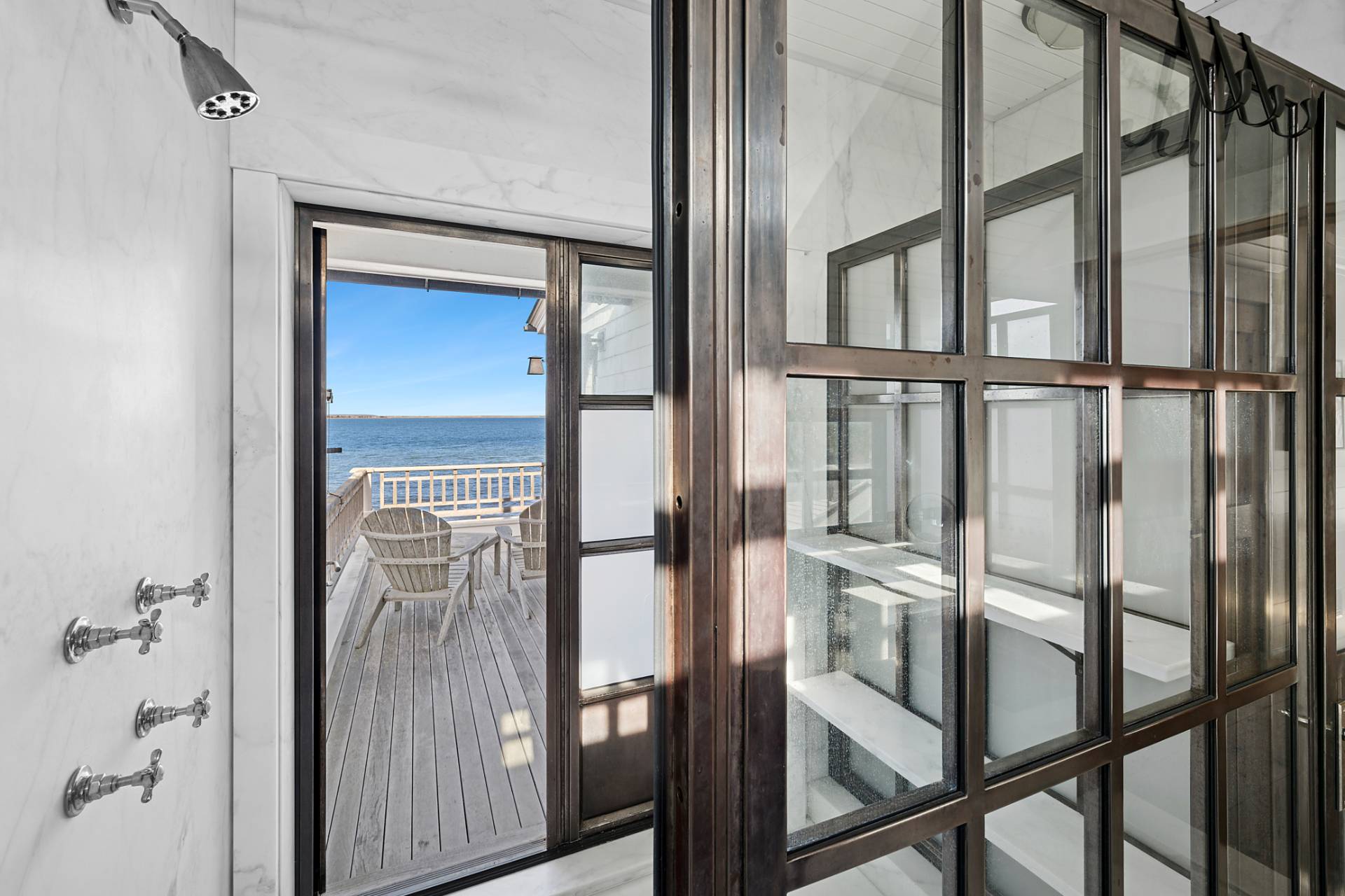 30 Private Road Amagansett, NY 11930 - Photo 18 of 26 a view of staircase with railing and chandelier