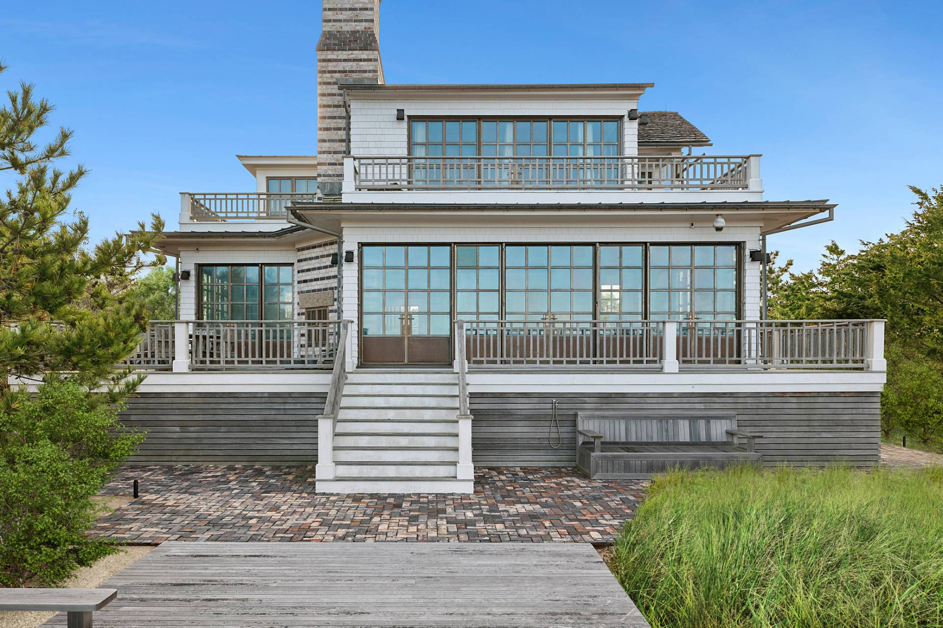 30 Private Road Amagansett, NY 11930 - Photo 2 of 26 a view of house with a yard and balcony