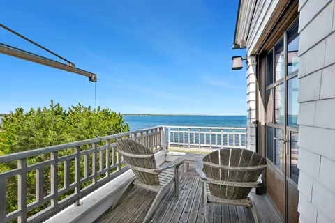 a view of balcony with furniture