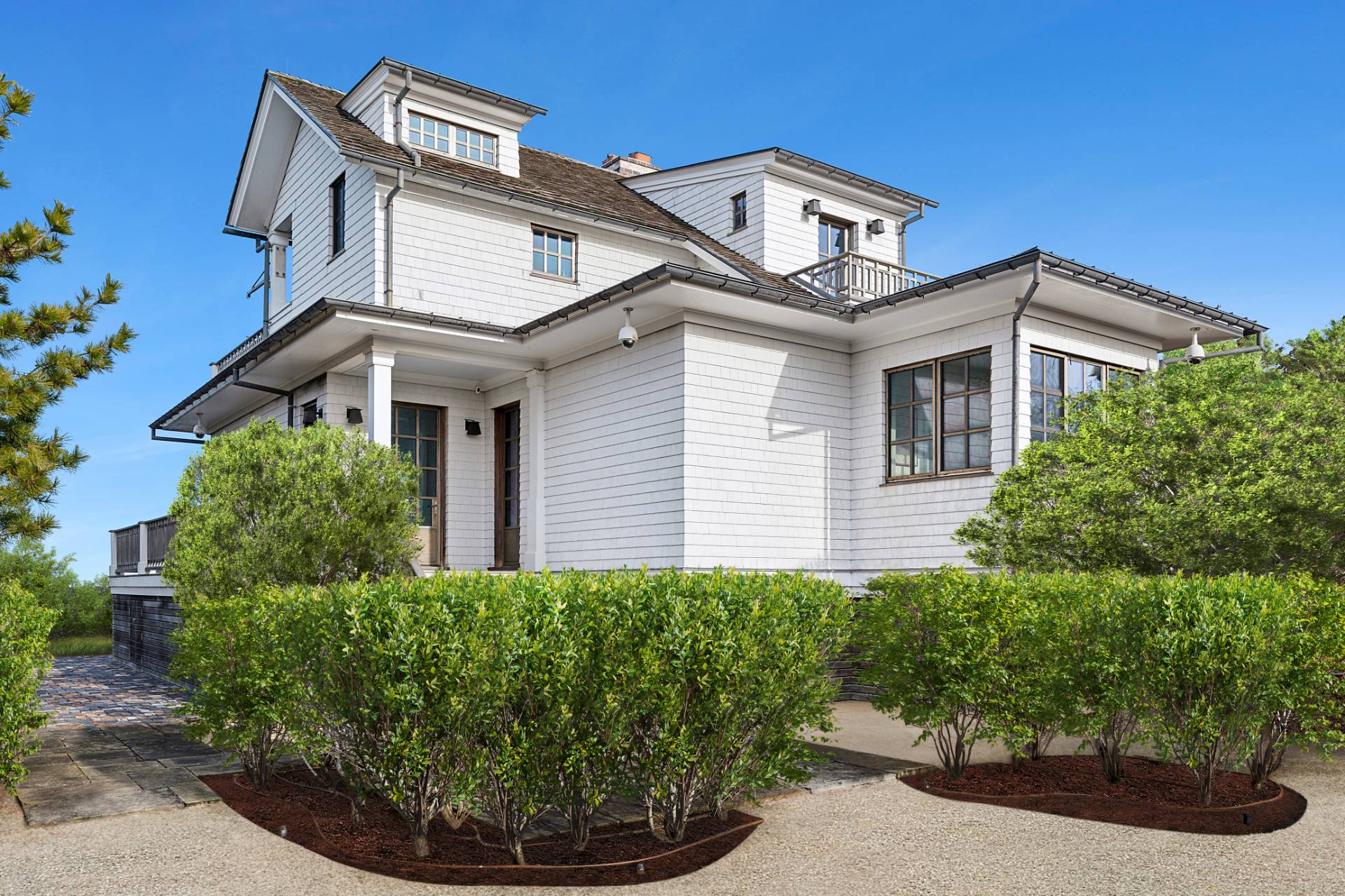 30 Private Road Amagansett, NY 11930 - Photo 3 of 26 a front view of a house with a yard