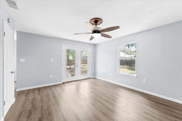 a view of an empty room with a window