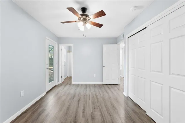 wooden floor in an empty room with a window