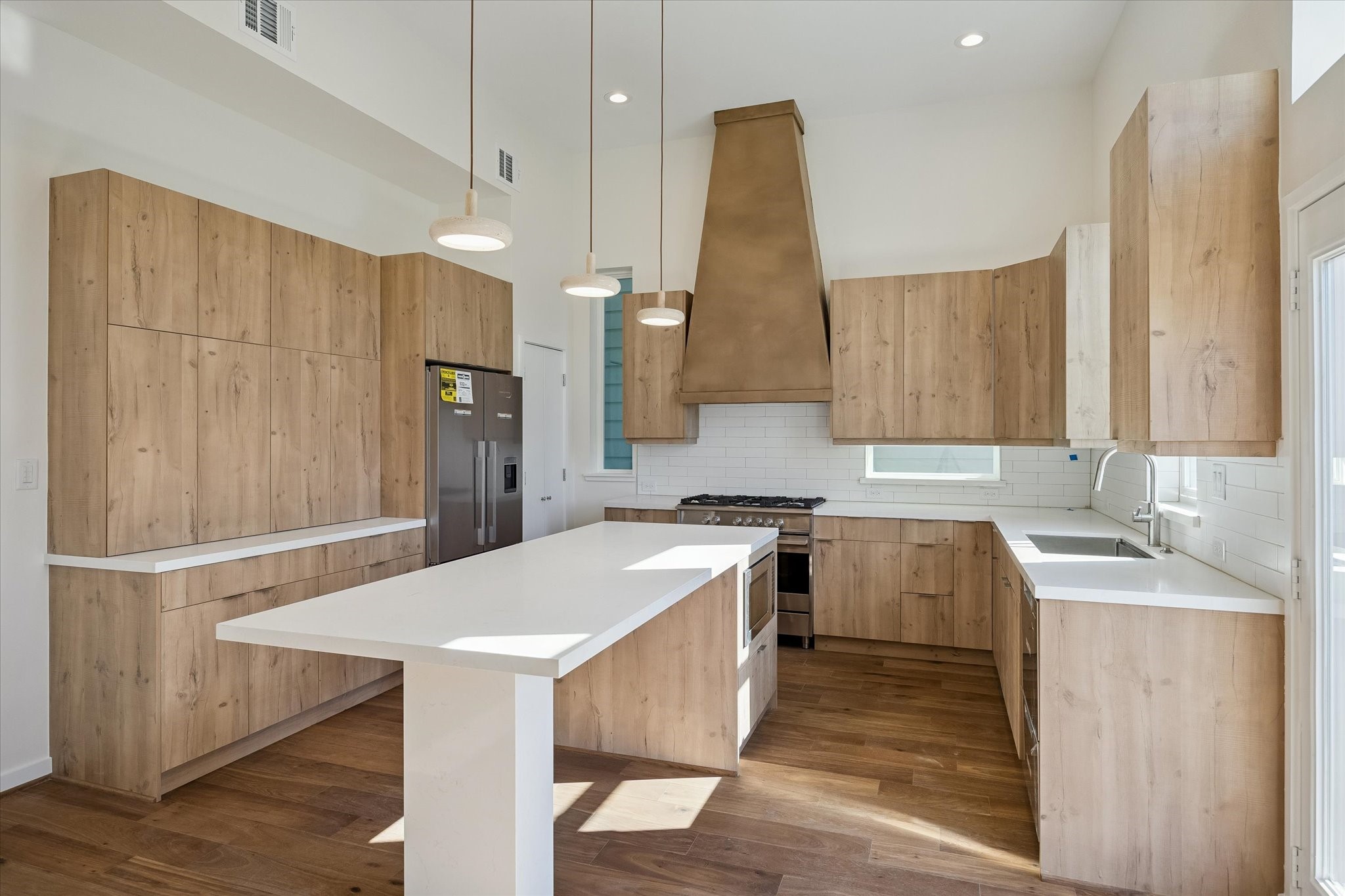 3906 Zina Way Houston, TX 77018 - Photo 1 of 7 a kitchen with a sink a stove a refrigerator and a oven