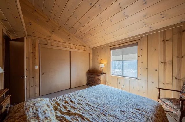 a bedroom with a bed chair and couch