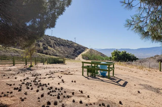 a view of a beach with a building in the background