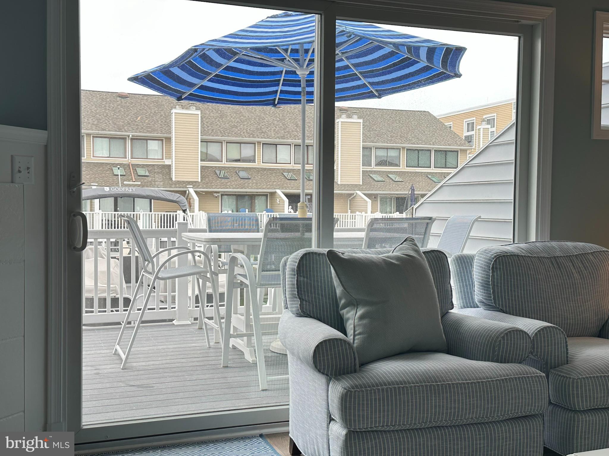 712 Mooring Road Ocean City, MD 21842 - Photo 11 of 60 a living room with furniture and a large window