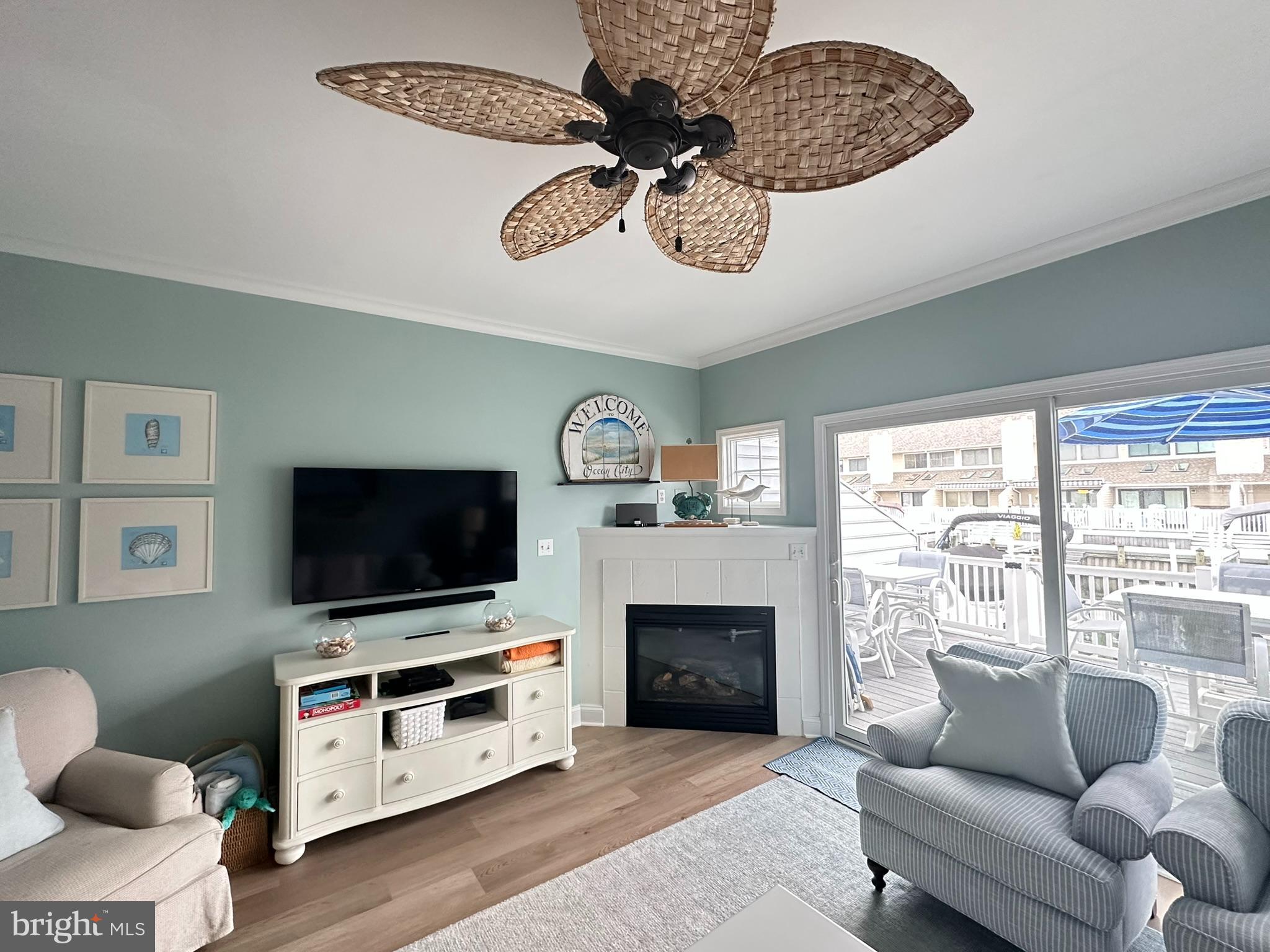 712 Mooring Road Ocean City, MD 21842 - Photo 12 of 60 a living room with furniture and a flat screen tv