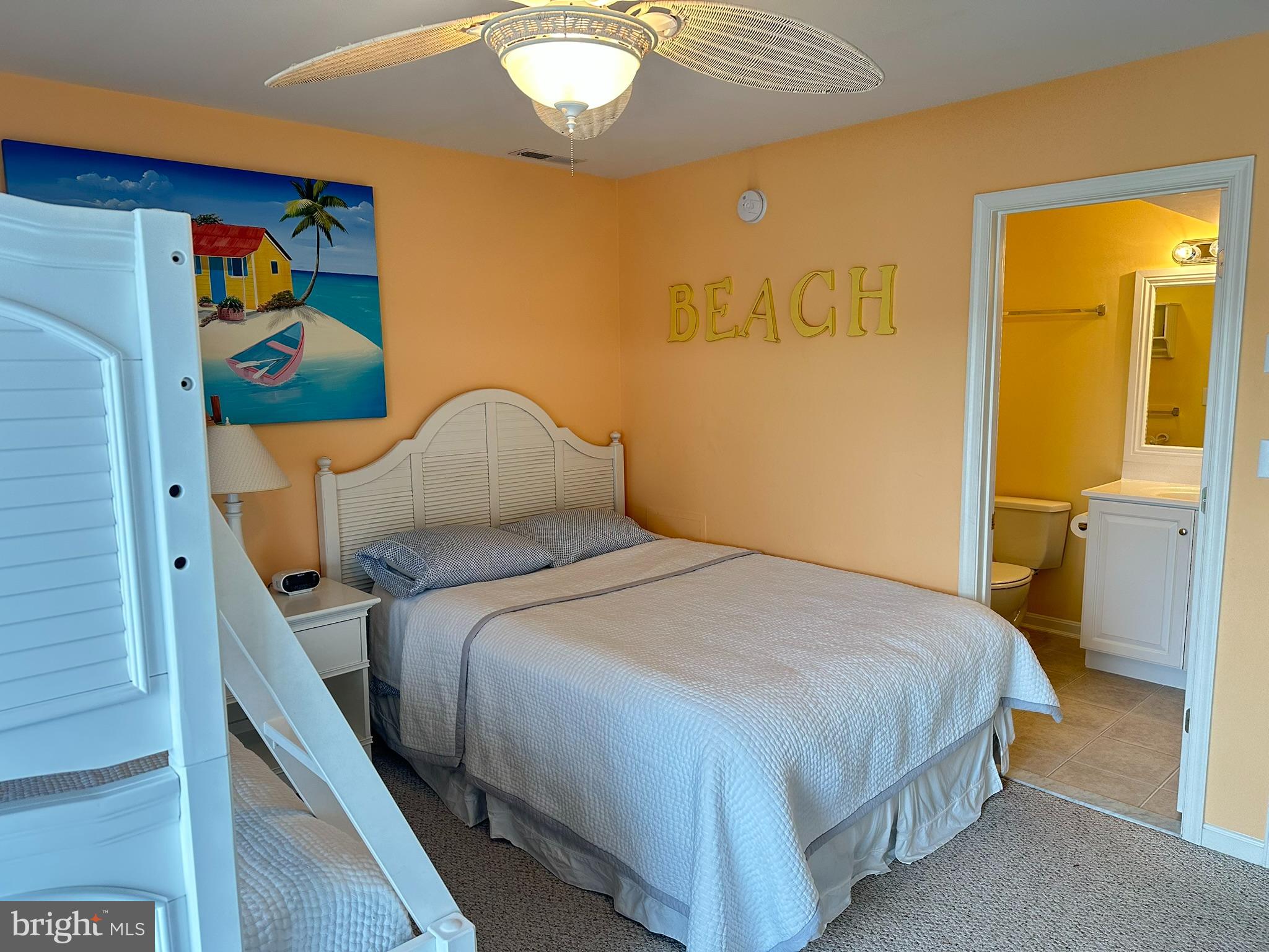 712 Mooring Road Ocean City, MD 21842 - Photo 17 of 60 a bedroom with a bed and painting on the wall