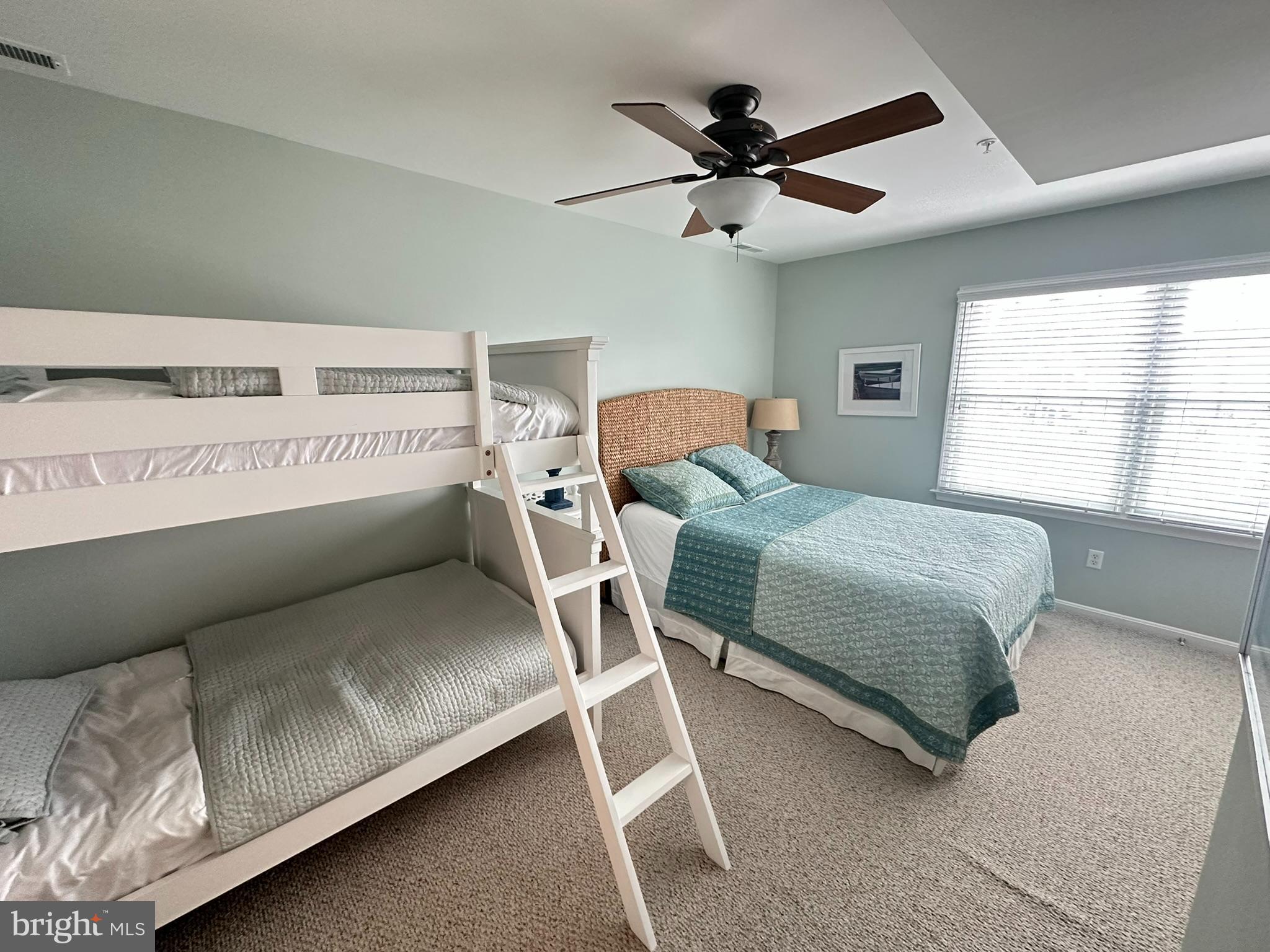 712 Mooring Road Ocean City, MD 21842 - Photo 26 of 60 a bedroom with a bed and window