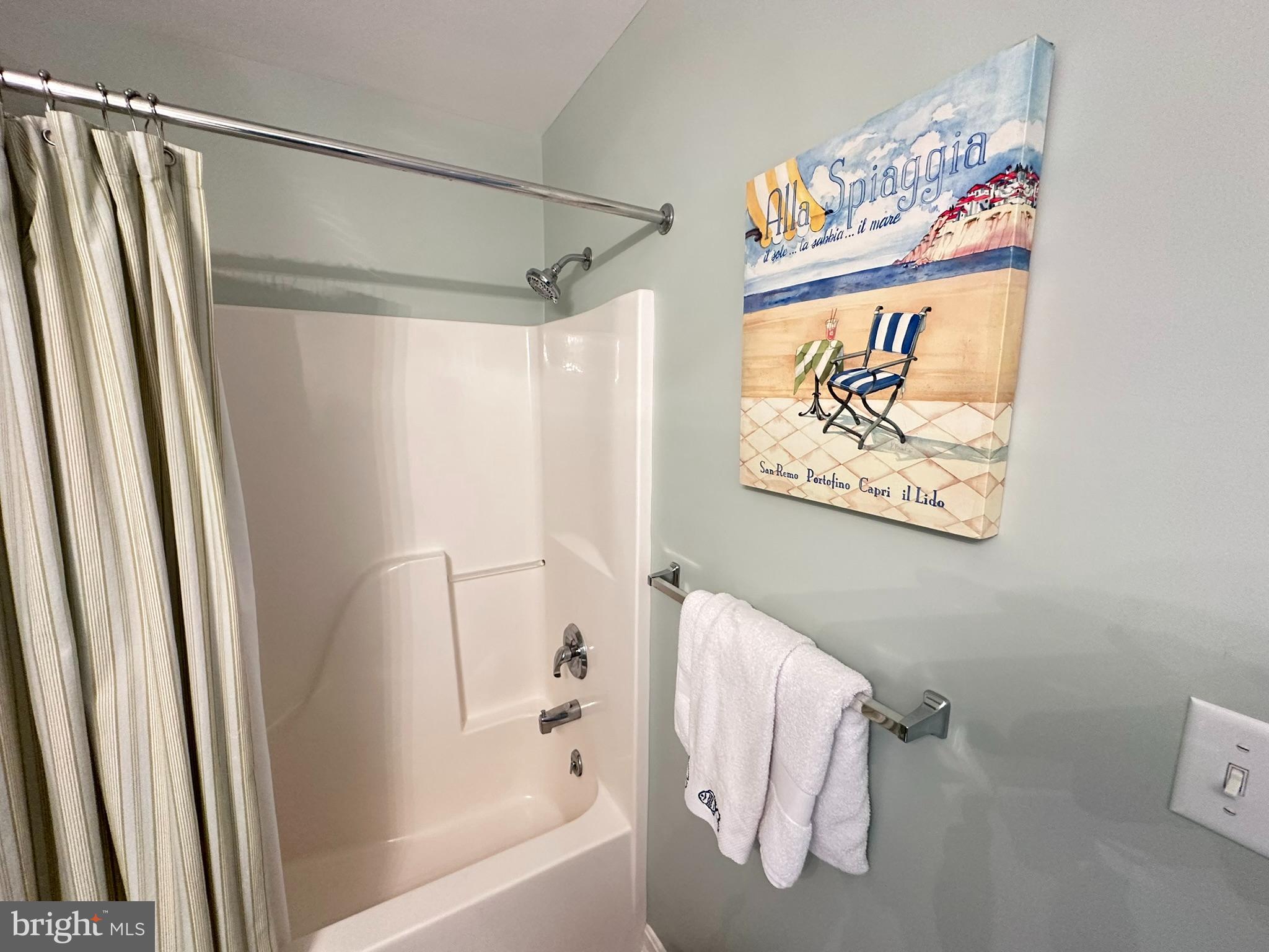 712 Mooring Road Ocean City, MD 21842 - Photo 32 of 60 a bathroom with a bathtub and a shower