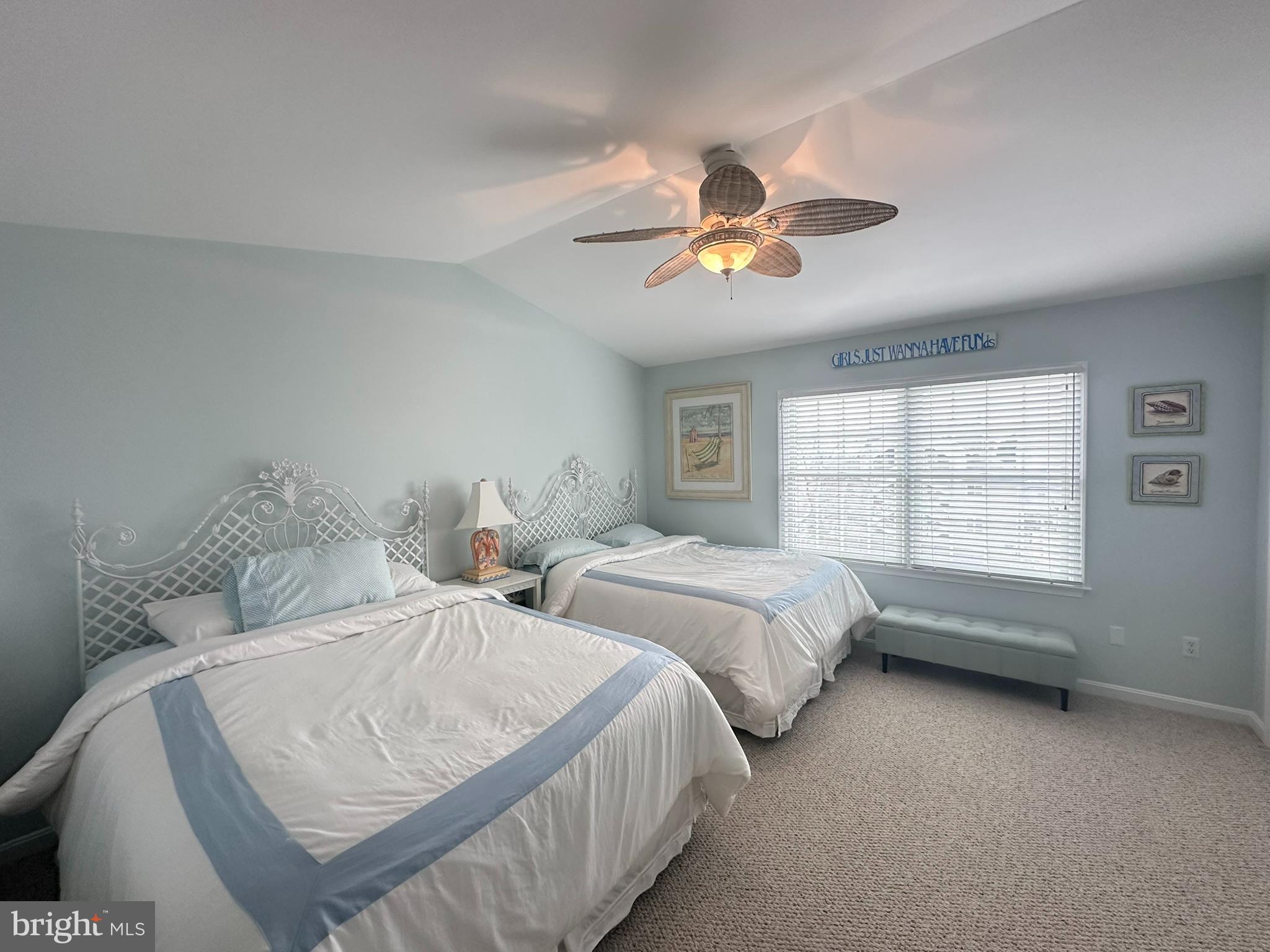 712 Mooring Road Ocean City, MD 21842 - Photo 36 of 60 a bedroom with two beds and a large window