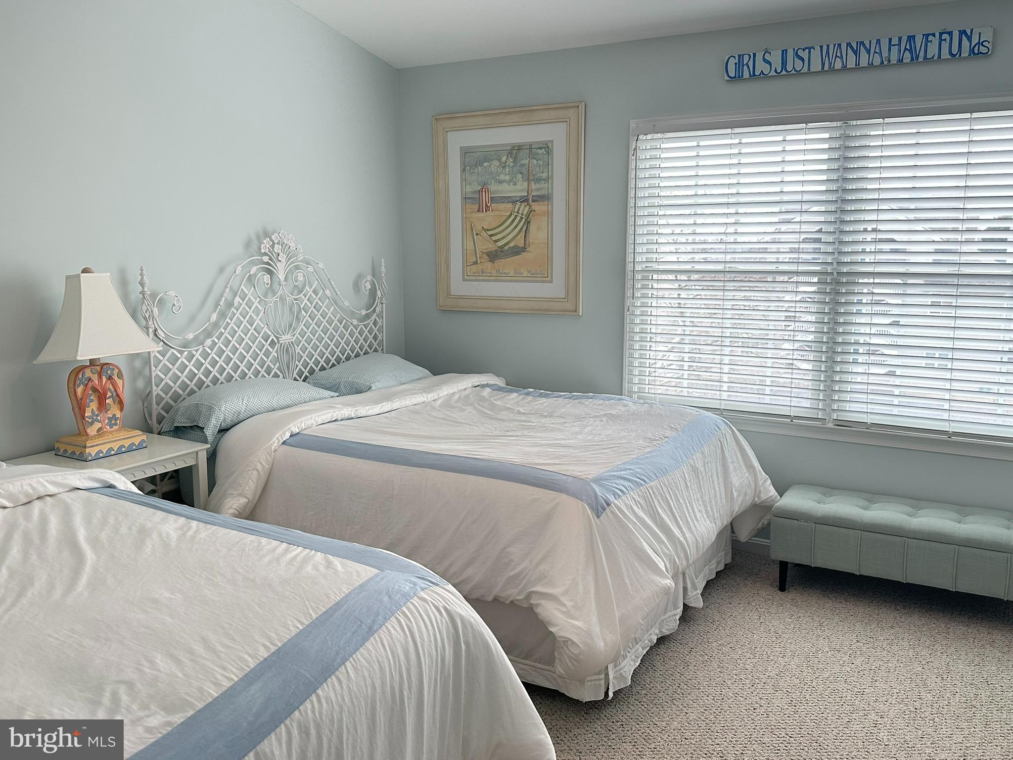 712 Mooring Road Ocean City, MD 21842 - Photo 37 of 60 a bedroom with two beds and a window