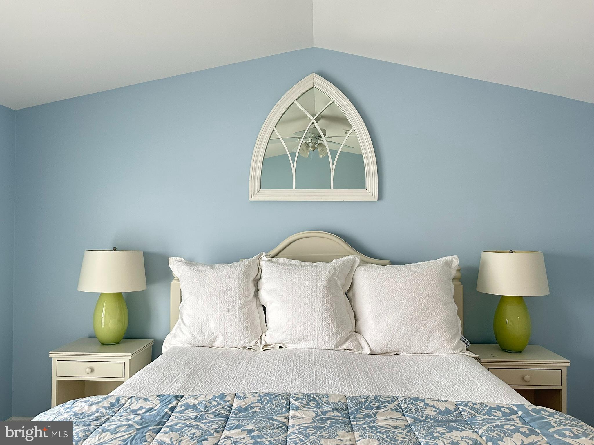 712 Mooring Road Ocean City, MD 21842 - Photo 42 of 60 a bedroom with a bed and a lamp