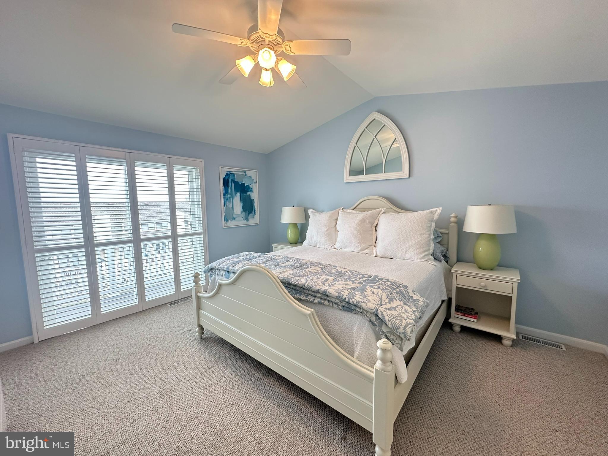 712 Mooring Road Ocean City, MD 21842 - Photo 44 of 60 a bedroom with a bed and a large window